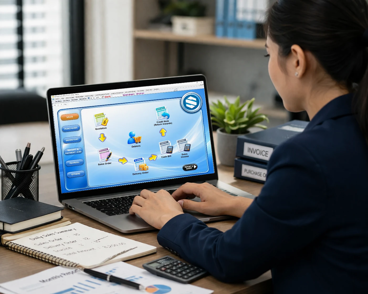 Accountant using Synergy accounting software on a laptop